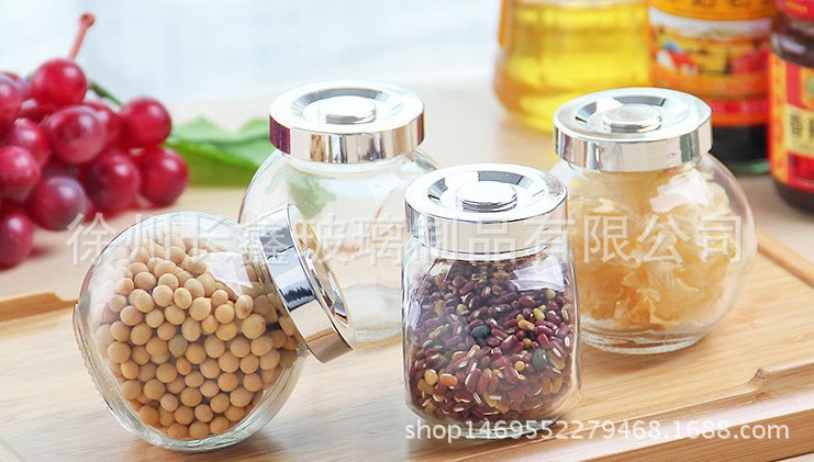 廠家直銷扁鼓玻璃儲物罐喜糖糖果瓶花茶密封瓶玻璃蜂蜜瓶調味瓶