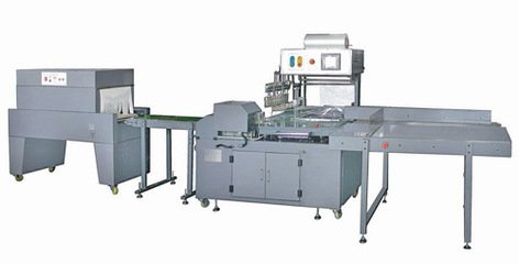滾邊封切熱收縮包裝機(jī)  熱收縮包裝機(jī)