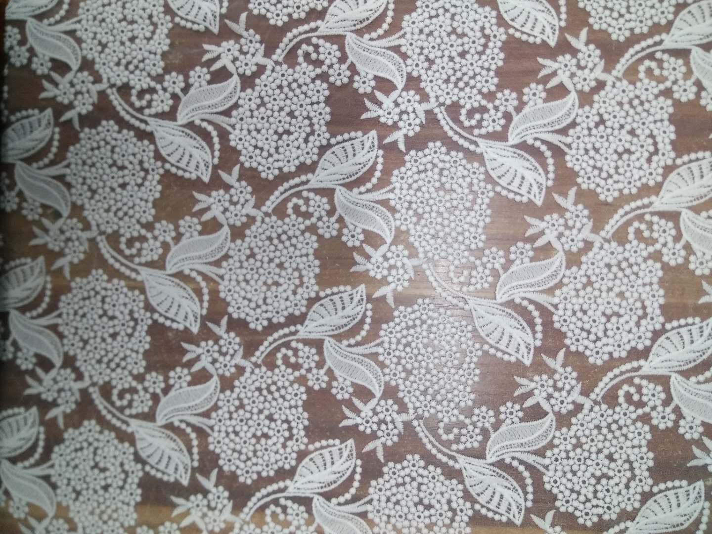 歐根紗牛奶絲網(wǎng)布繡花花邊面料  時(shí)尚刺繡繡花雕孔花邊面料