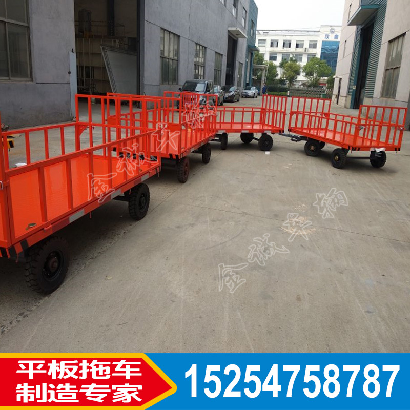 廠區(qū)圍欄式平板拖車 場(chǎng)內(nèi)周轉(zhuǎn)貨物帶轉(zhuǎn)向的平板車山東廠家非標(biāo)定制