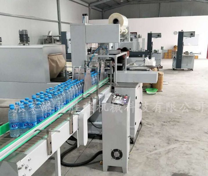 新勝強(qiáng)全自動膜包機(jī) PE膜包裝機(jī) 紙箱包裝機(jī) 易拉罐膜包裝機(jī)廠家